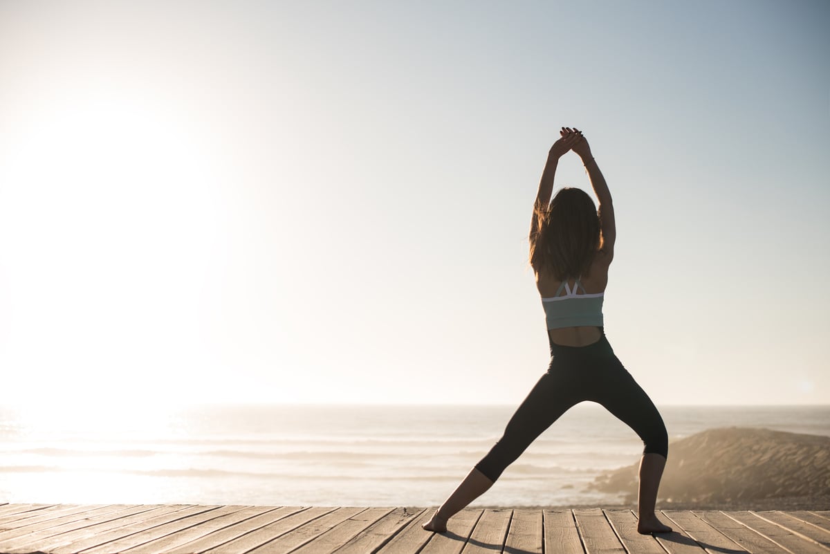 Women doing pilates on the beach